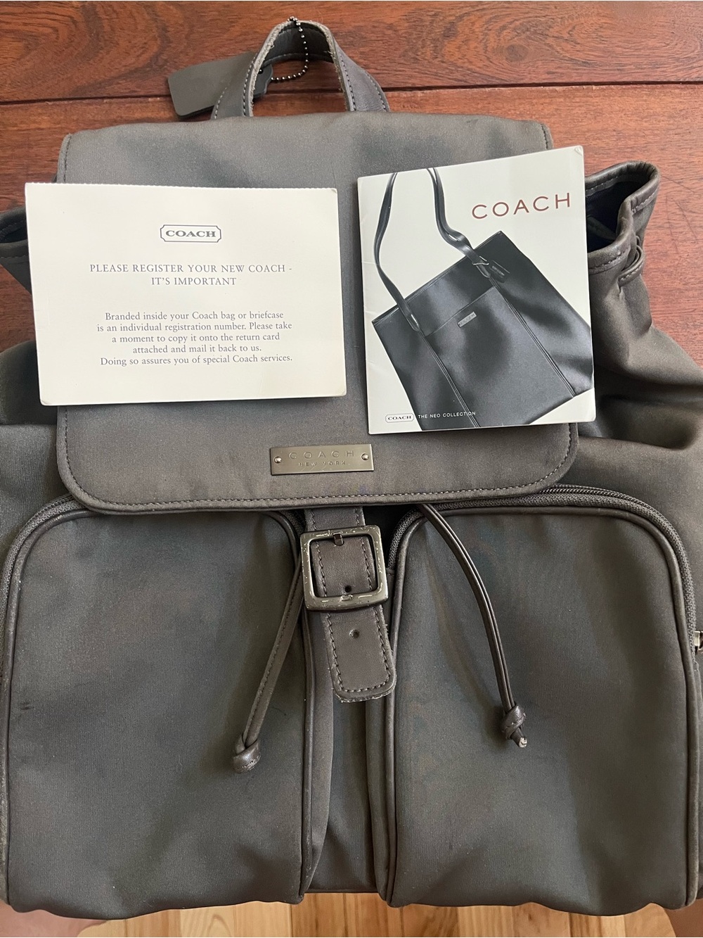 COACH Charcoal Backpack with Front Pockets. Leather trim, straps, and base.